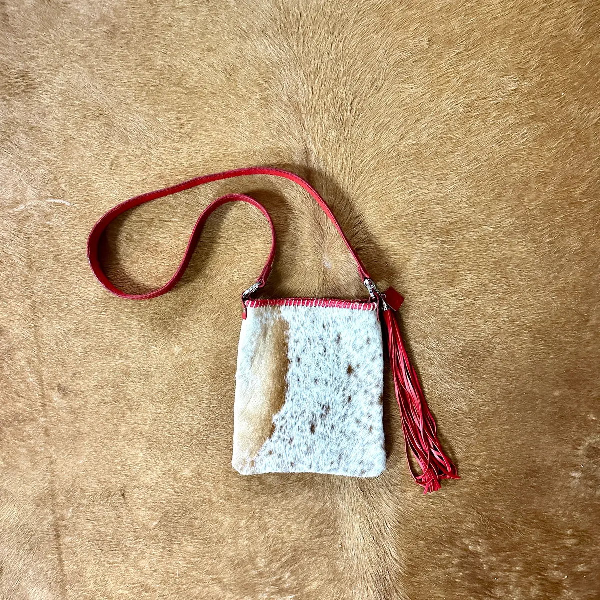 Hand Made Cowhide And Red Leather Purse At Bourbon Cowgirl 1